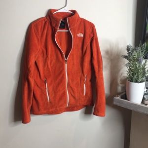 Orange north face zip up fleece jacket